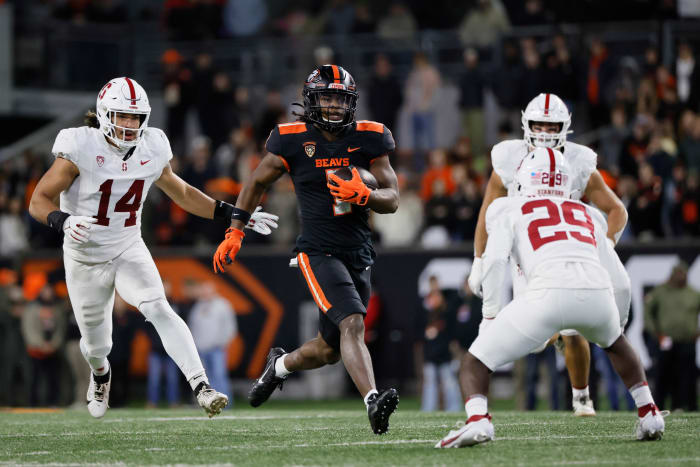 Nov 11, 2023; Corvallis, Oregon, USA; Oregon State Beavers running back Deshaun Fenwick (1) runs the ball against Stanford Cardinal corner back Terian Williams (29) during the second half at Reser Stadium. Mandatory Credit: Soobum Im-USA TODAY Sports